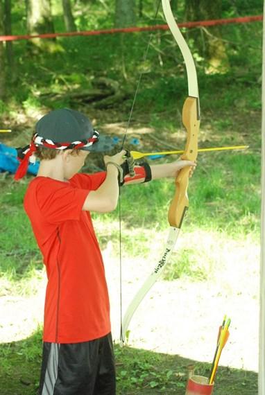 Little boy holding bow and arrow