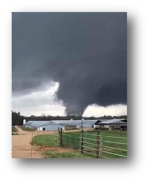 Tornado coming toward a farm