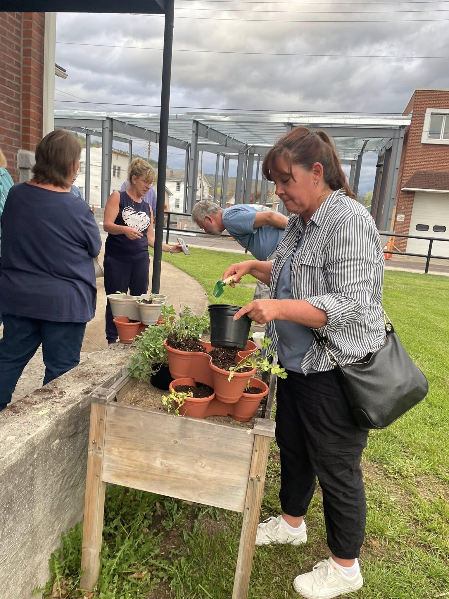 Woman potting plants