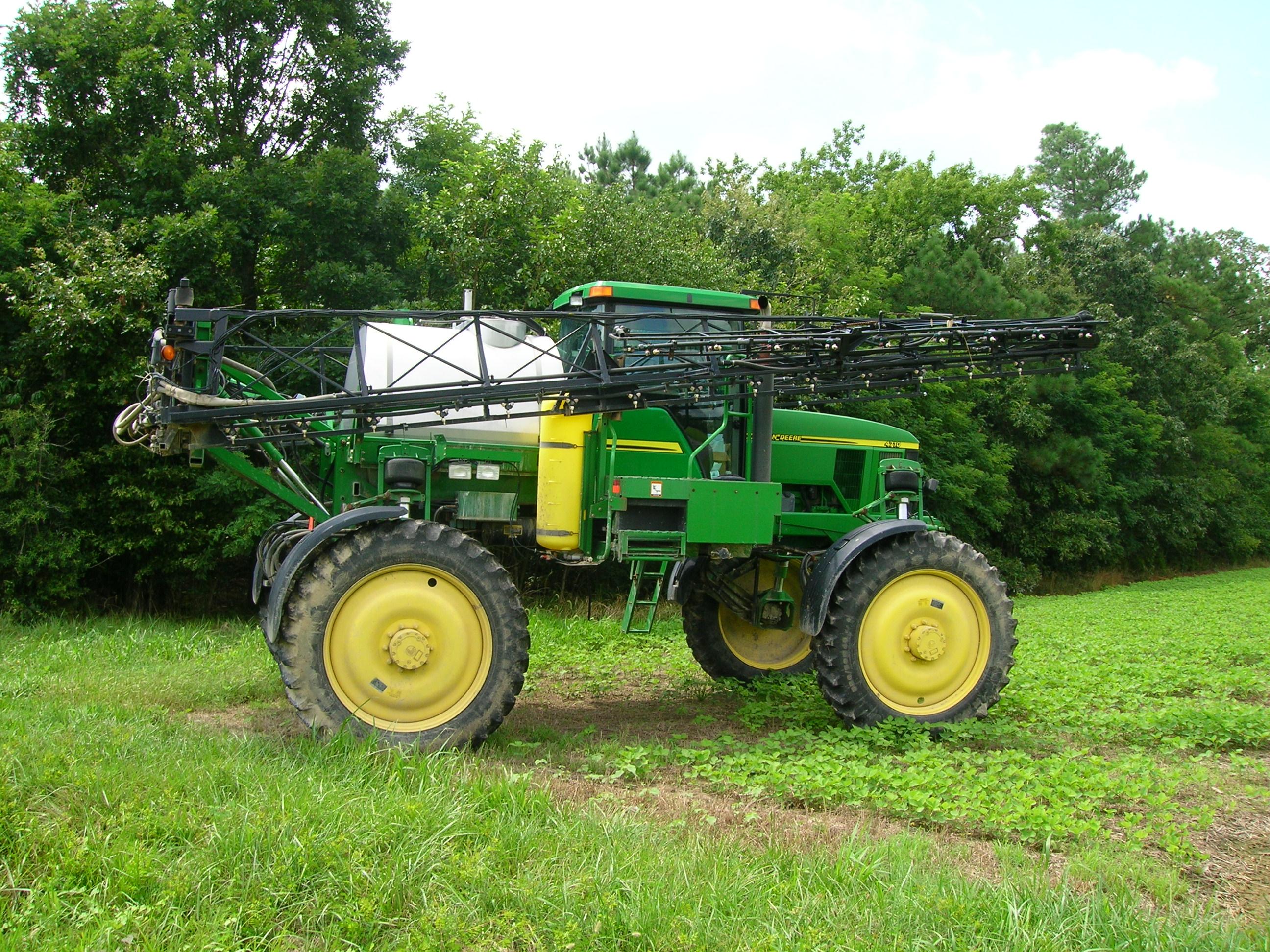 Tractor with spraying equipment