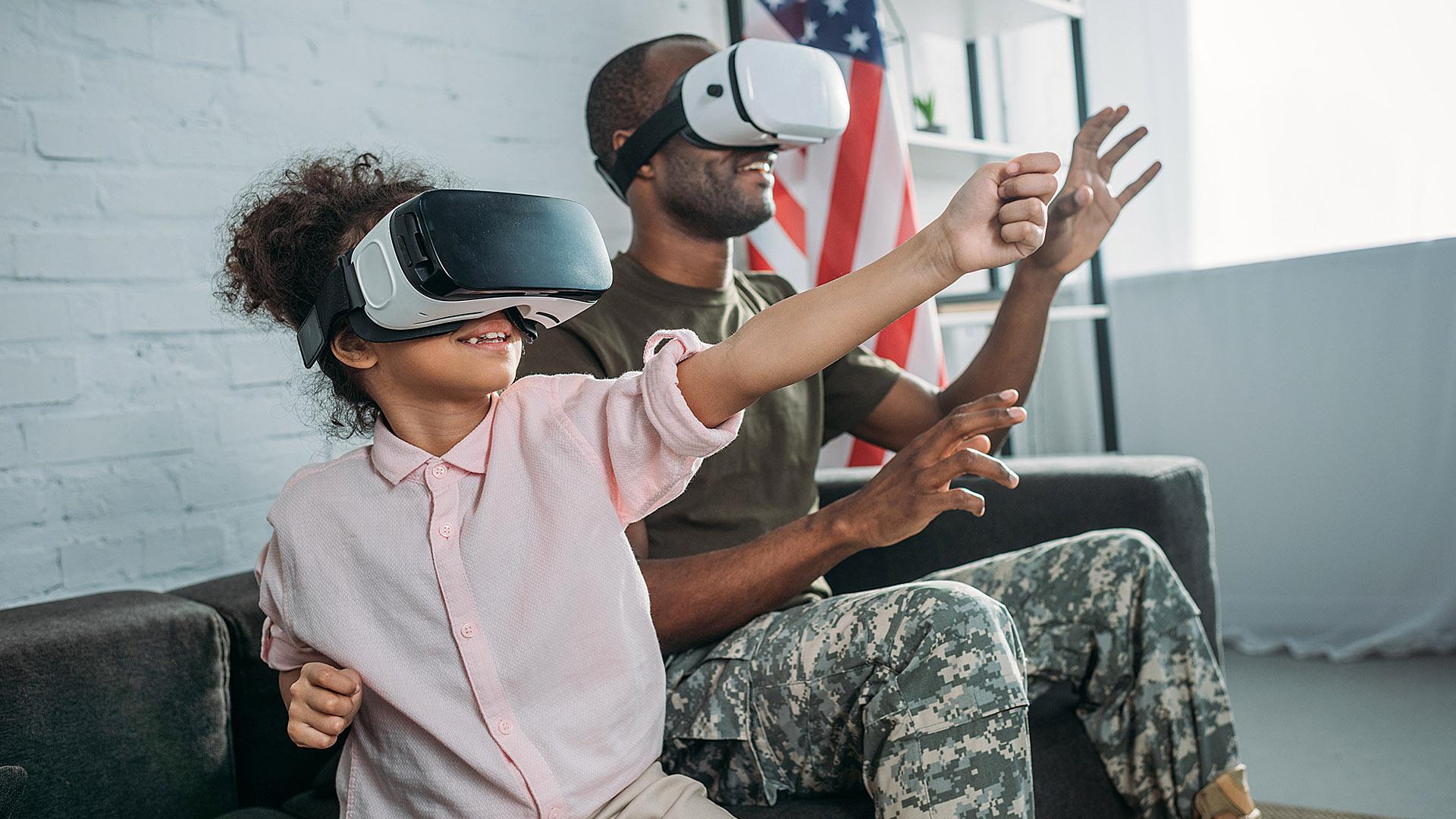 Father and daughter looking through VR goggles