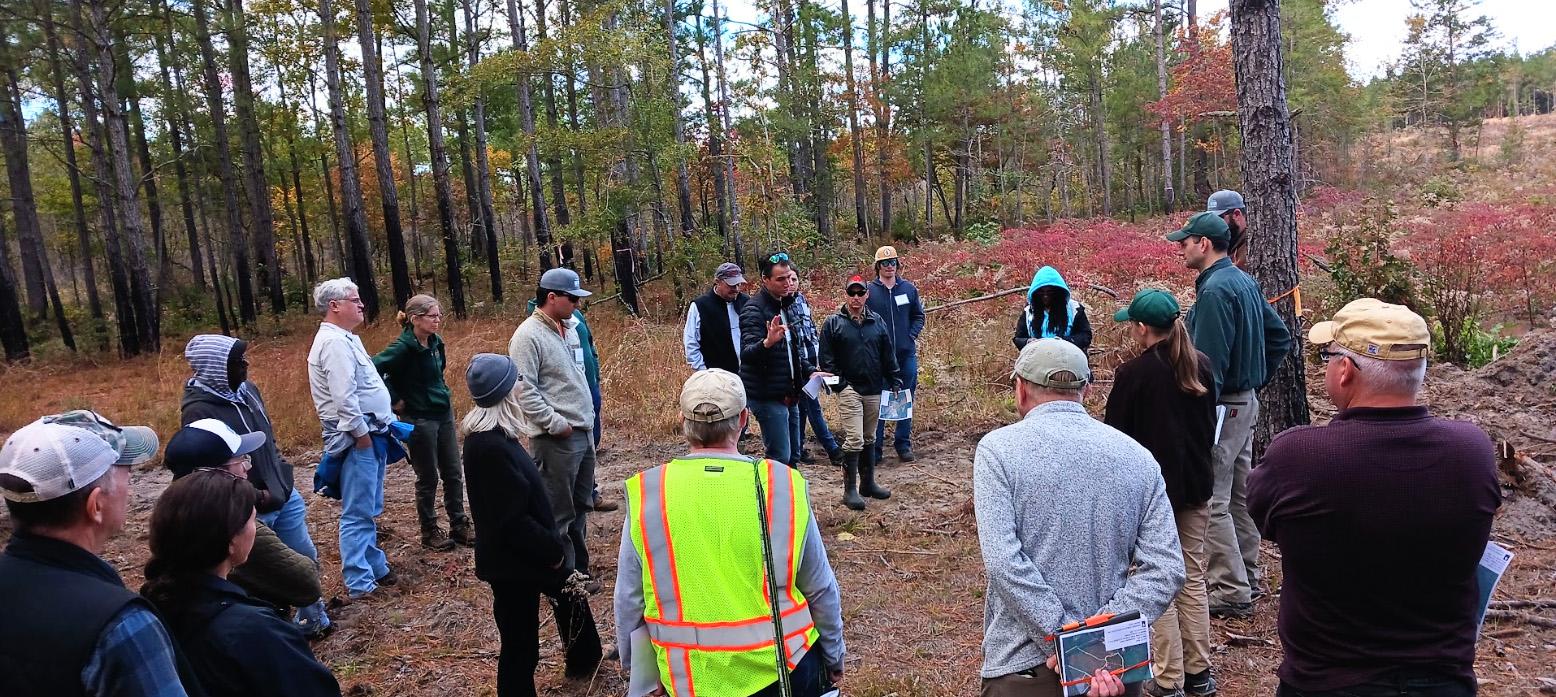 Luke Macaulay, UME (center), discusses the importance of early successional habitat for wildlife.  