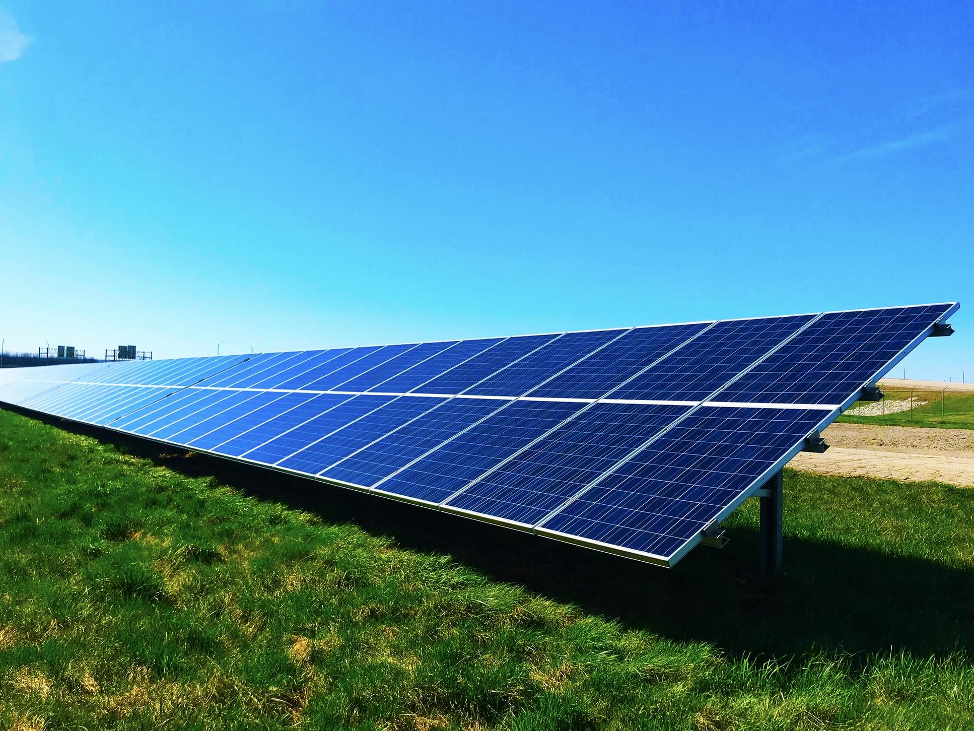 Ground-mounted solar panels in field