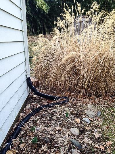 water from downspout diverted to yard