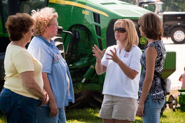 Annie's Project Extension Educators Shannon Dill and Jenny Rhodes, talking with farm women. 