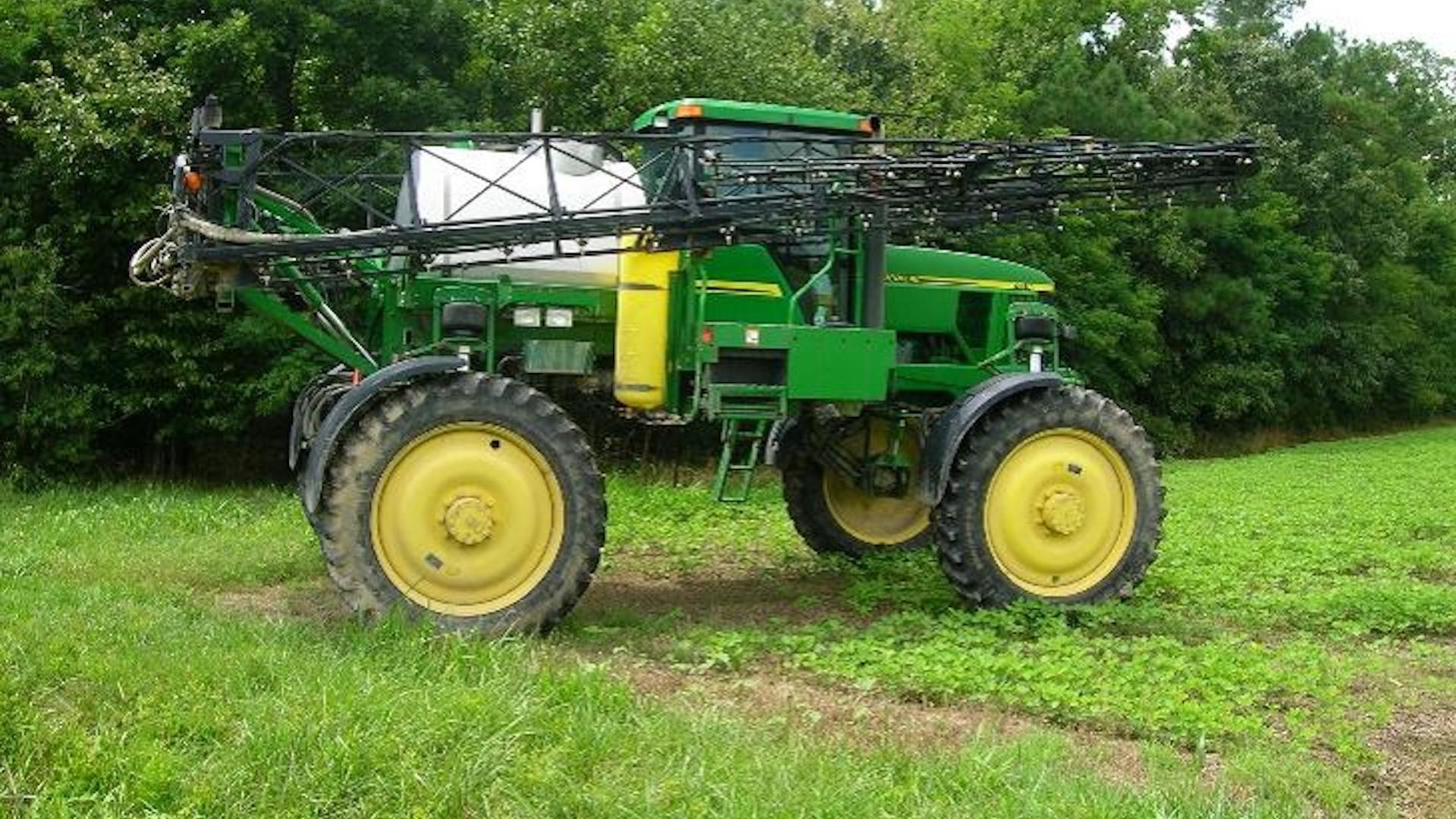 Picture of a tractor with pesticide applicator attachment