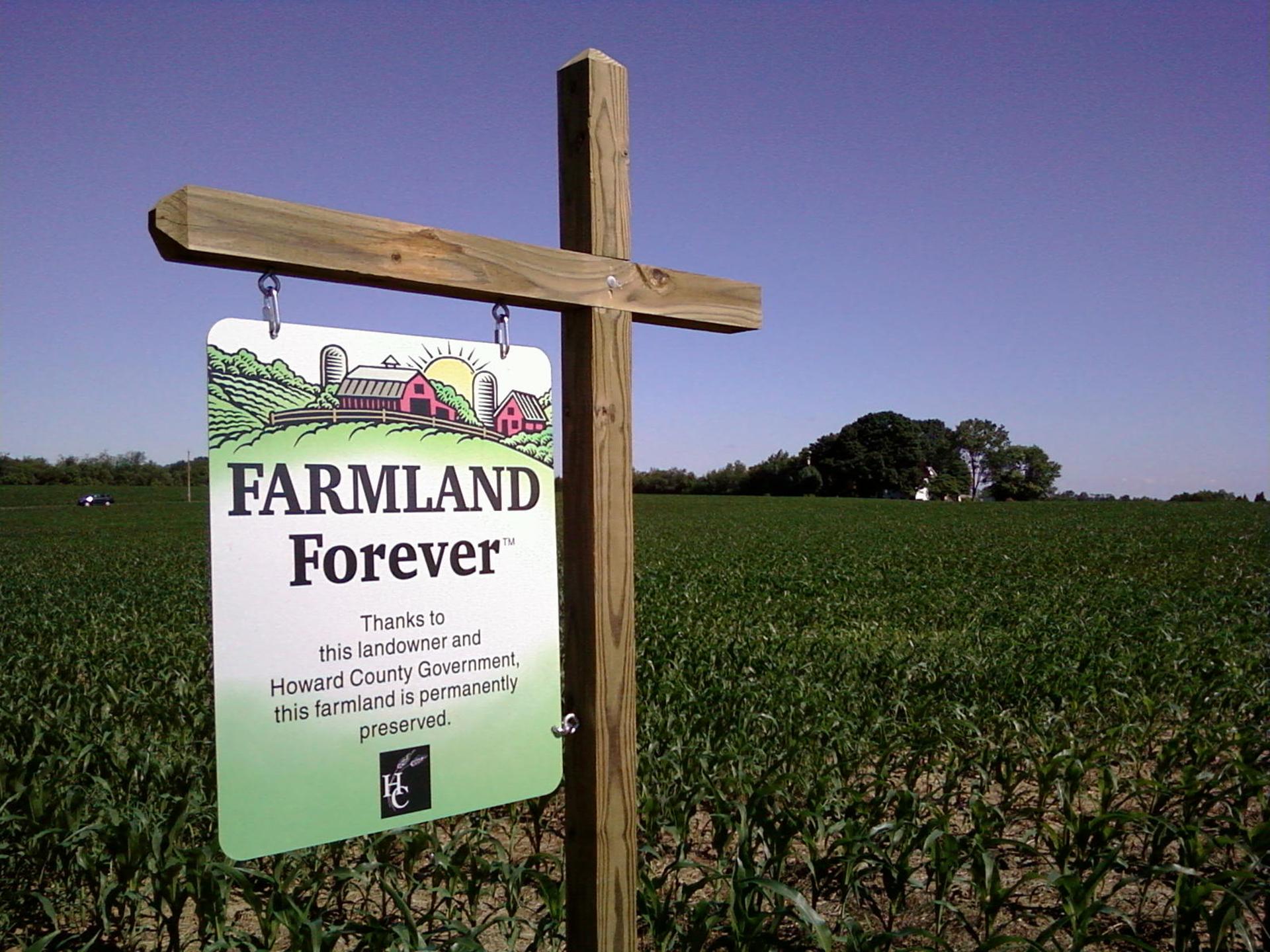 Sign in field that reads Farmland Forever thanks to this landowner and howard county government this farmland is permanently preserved