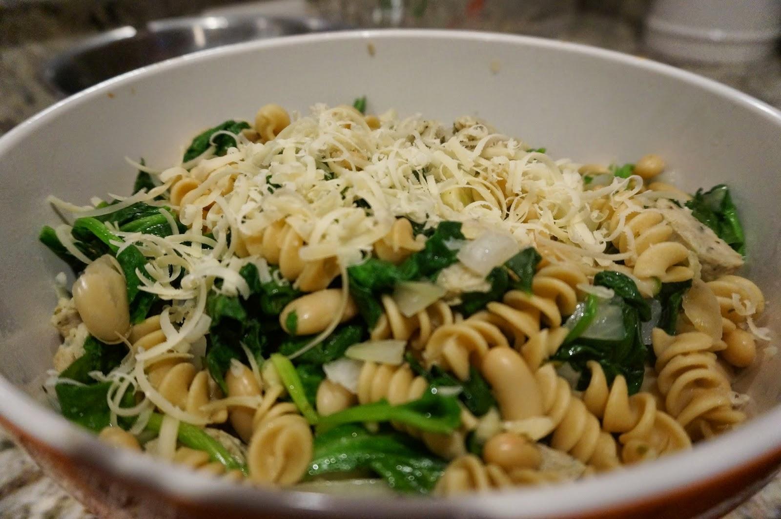 Whole grain rotini pasta cooked with swiss chard and topped with shredded parmesan cheese.