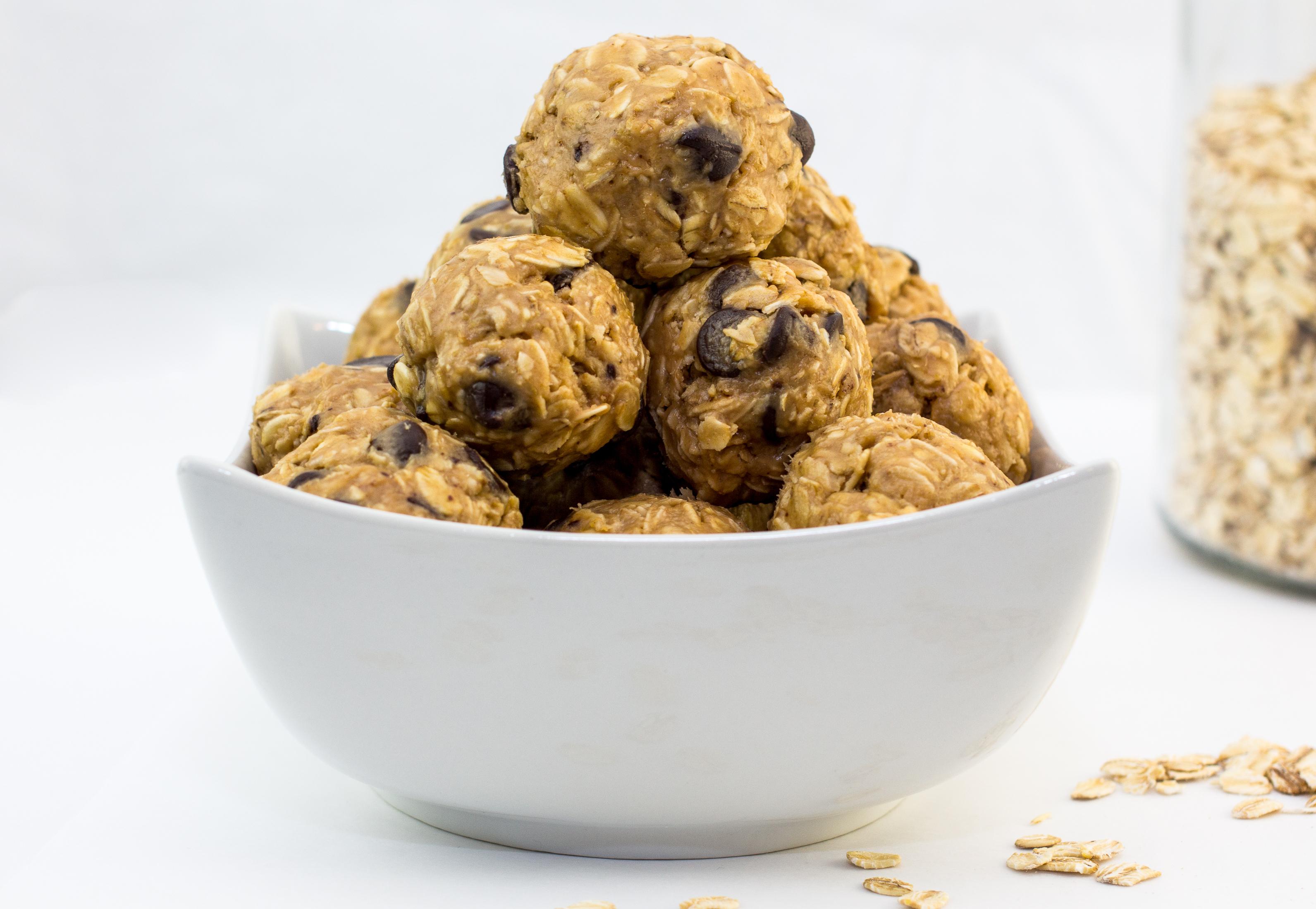Oatmeal energy bites with chocolate chips and stacked in a white bowl.  (Shutterstock -- LW rights)