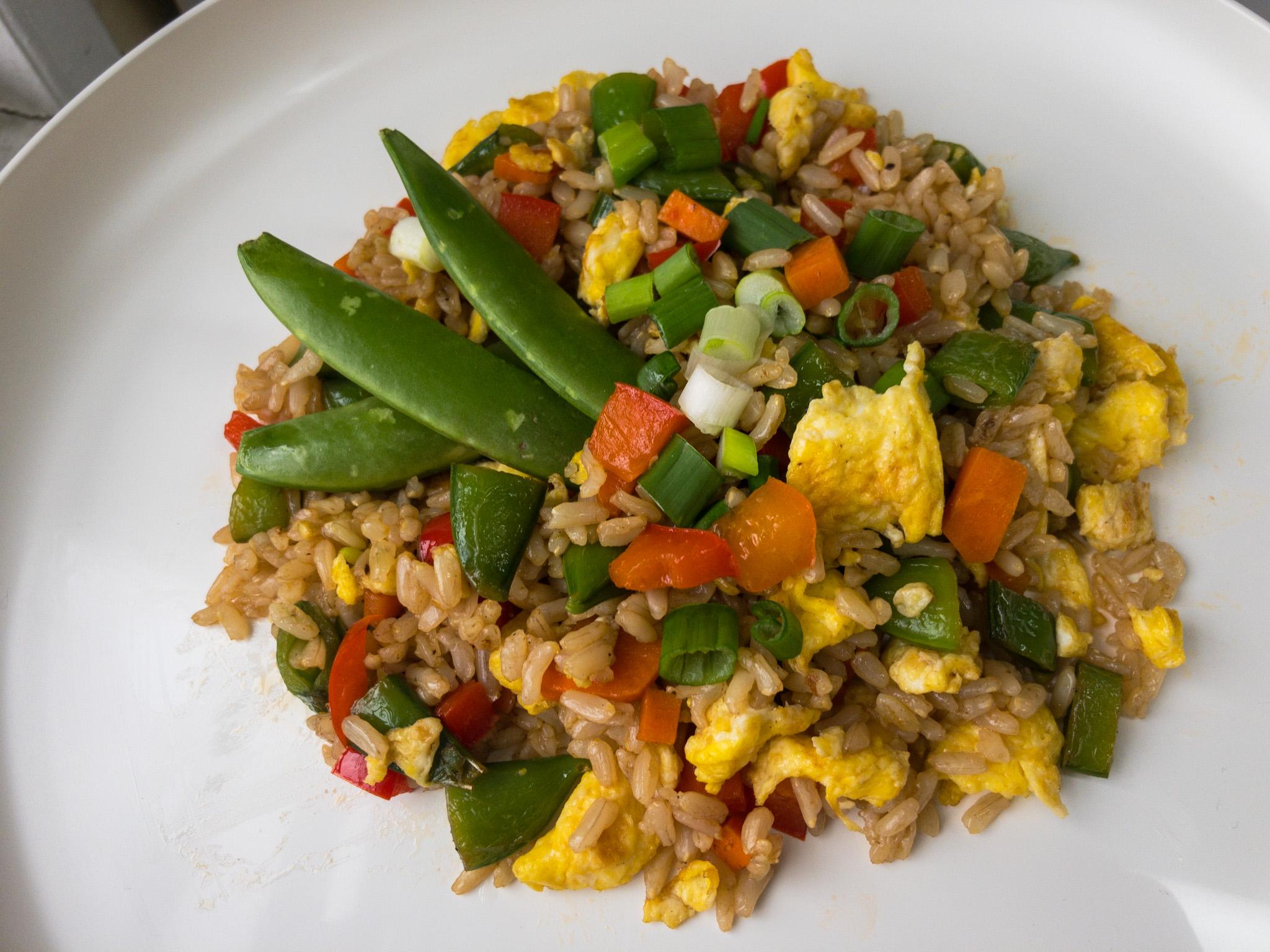 Fried rice with sugar snap peas, red peppers, green onions, and scrambled egg.