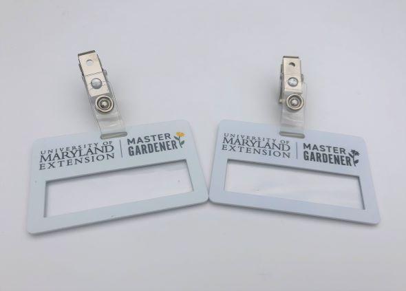 Two MG name badge color options