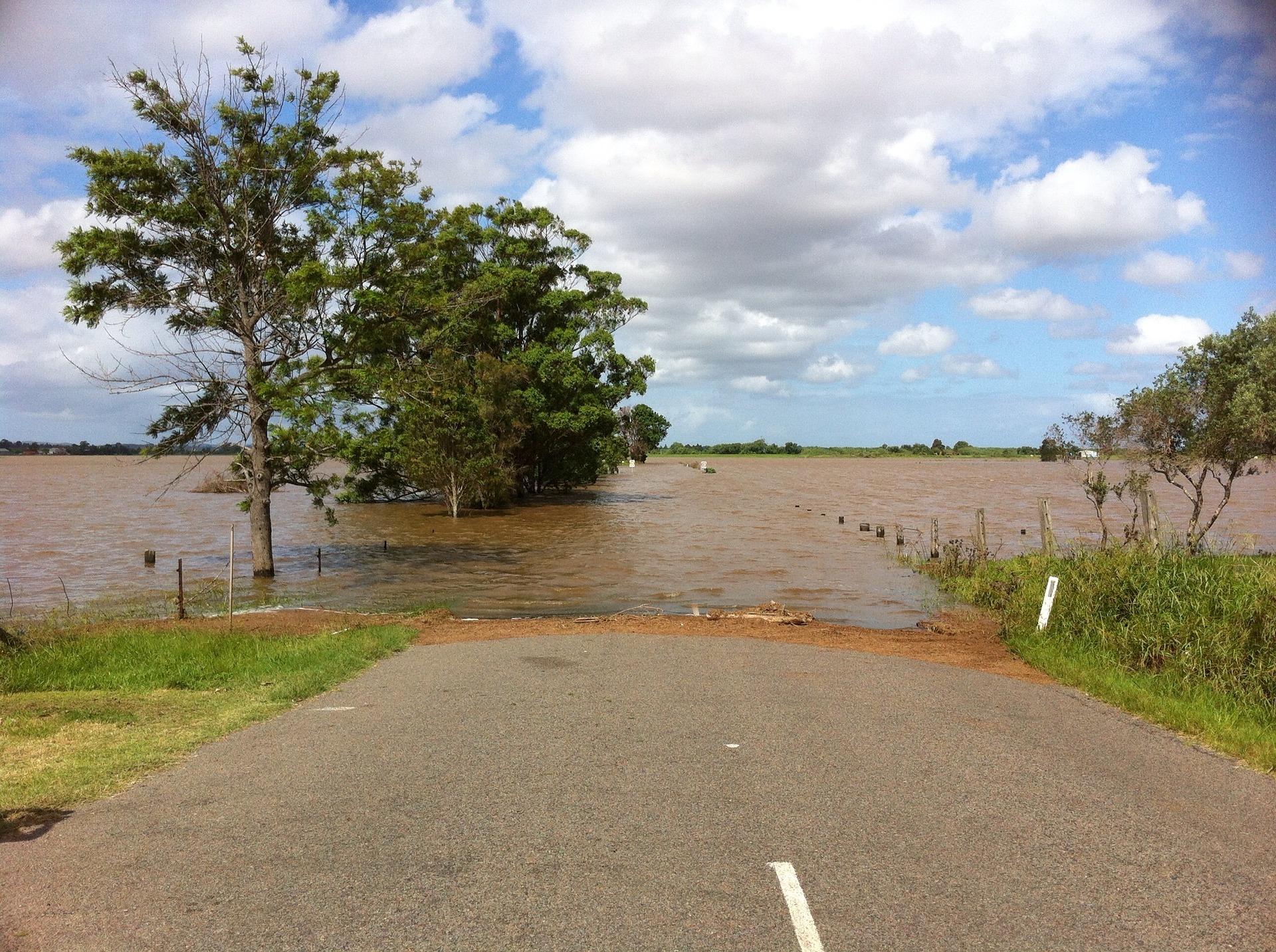 Standing water covering road and fields