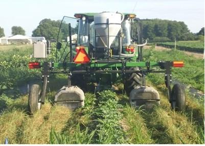 Figure 1. Tractor-Mounted shielded sprayer used for cover crop termination.