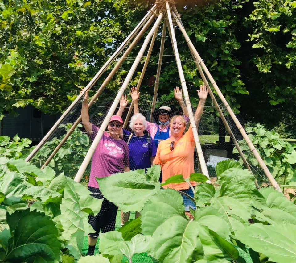 Charles County Master Gardeners celebrating in pollinator garden