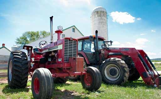 Two tractors parked in front of barn.  Photo: Edwin Remsberg