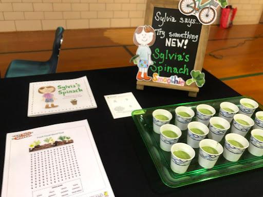 Spinach tasting table with spinach smoothies.