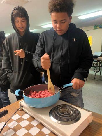Youth learning to cook