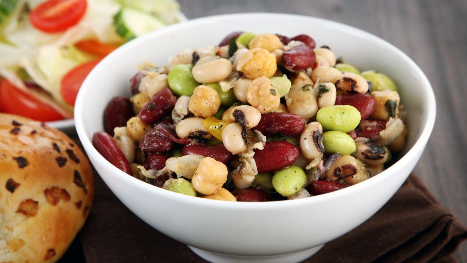A bean salad with black eyed peas, edamame, kidney and garbanzo beans.