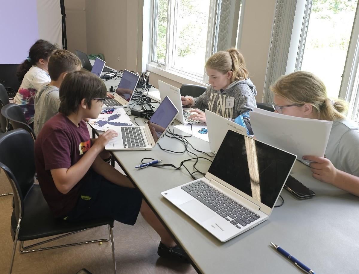 4-H Camp Youth Attendees create pixel art in spreadsheets.