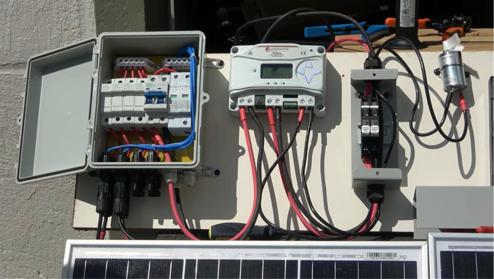 Wiring a (PV) system with a combiner box, charge controller, and breaker box.