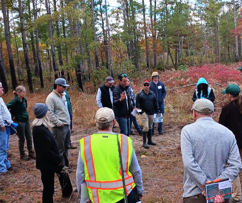 Luke Macaulay, UME (center), discusses the importance of early successional habitat for wildlife.  