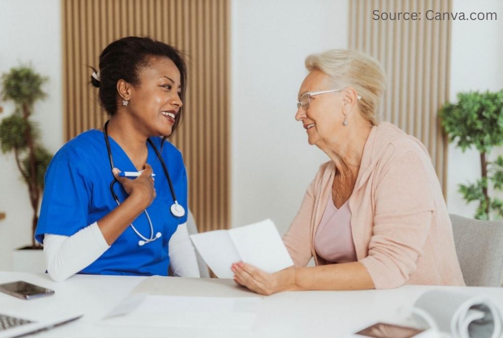 A female healthcare provider is communicating with a senior female patient.