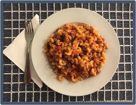 A serving of Hamburger Casserole on a dinner plate