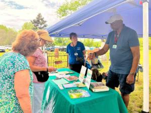 Man at an information table for the Master Gardeners Program