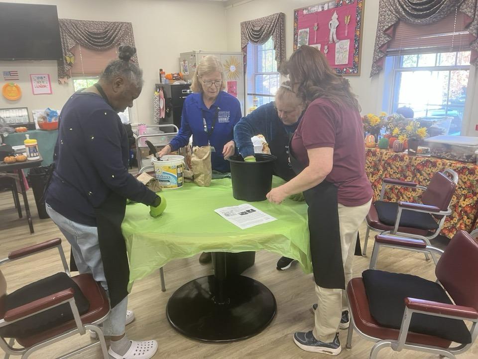 Four MG volunteers helping at a Senior Center