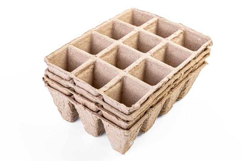 Pale brown peat moss-based cell pack unit with 12 cells arranged in 4 rows of 3 cells.