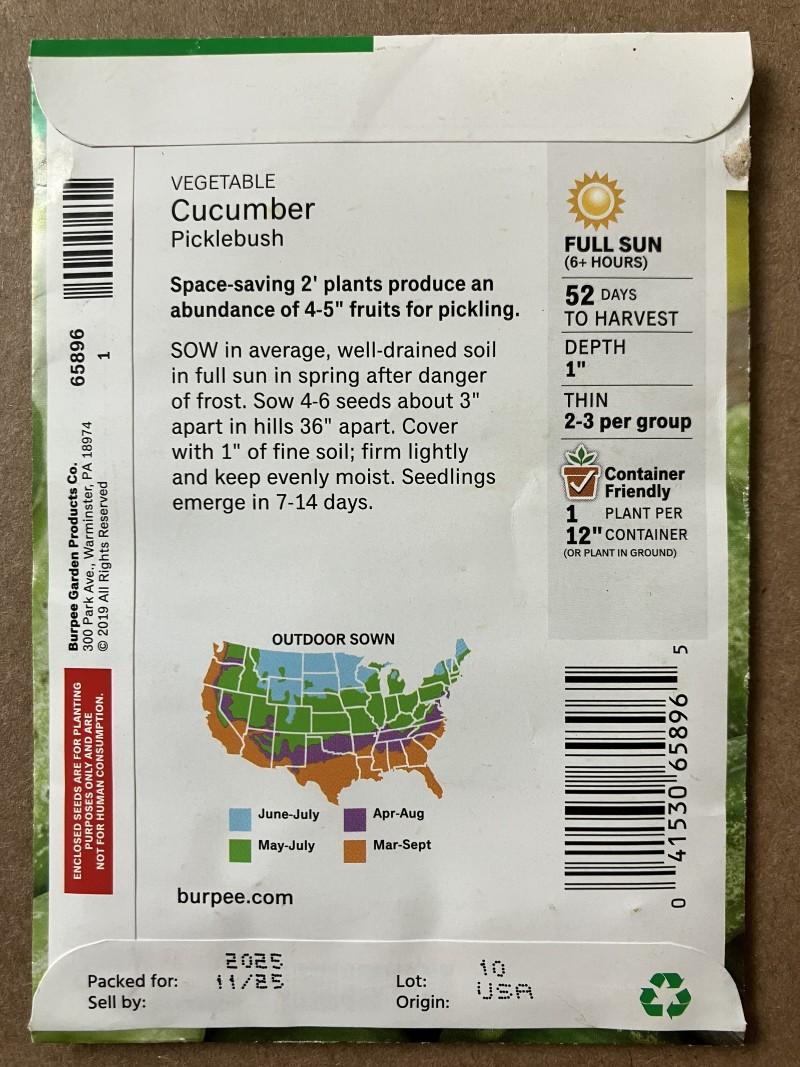 The back of a cucumber seed packet with planting instructions that include sun exposure, planting depth, and spacing between seeds.