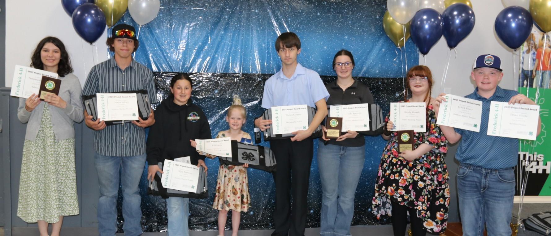 4-H members receiving awards at the annual awards ceremony