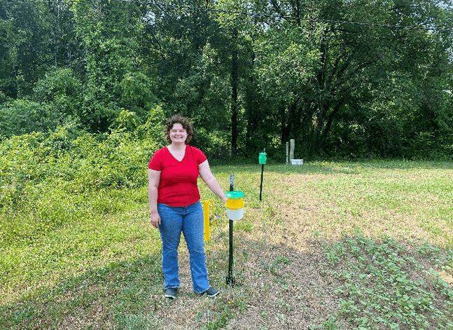 Heather Knauss in front of moth traps