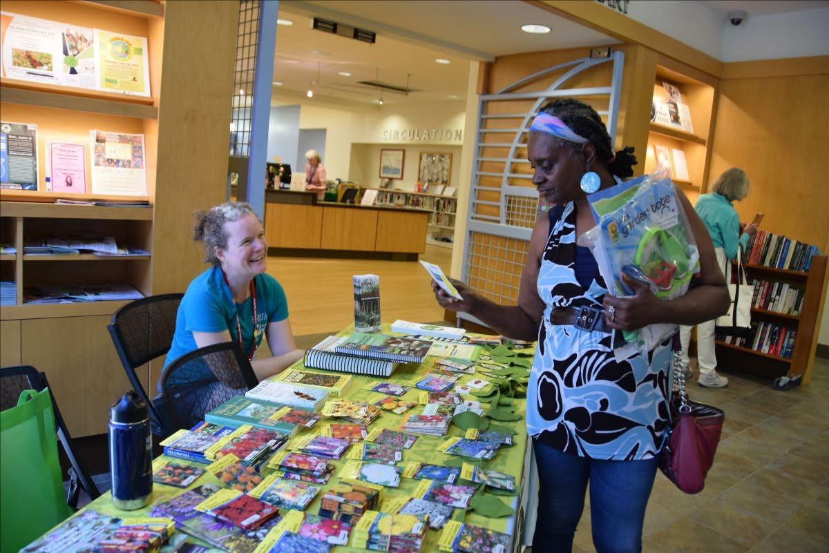 Visitor getting seeds at the Talbot County seed library